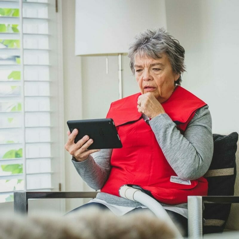 Woman on tablet learning about mucus buildup