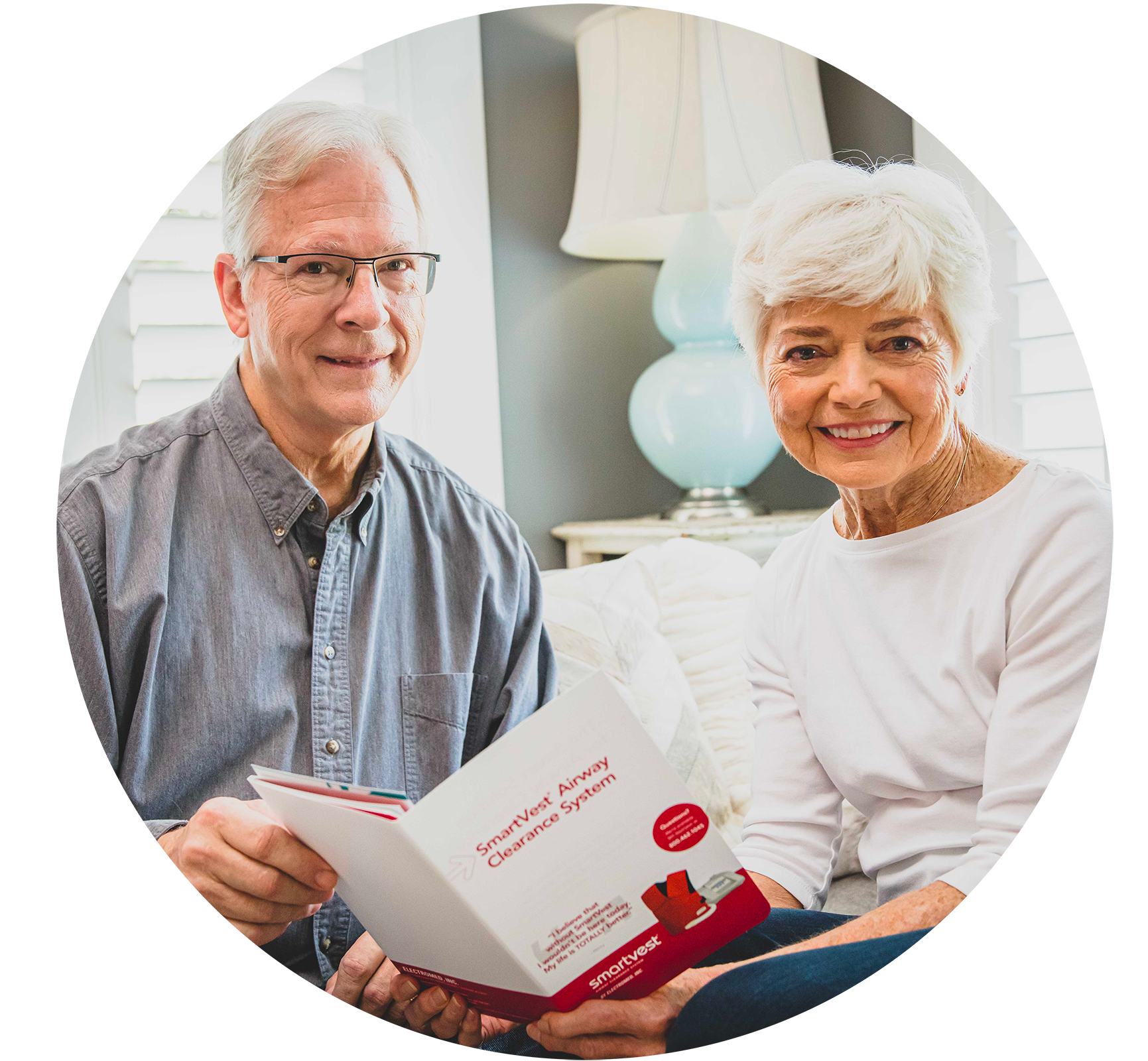 Elderly couple reviewing SmartVest informational packet.