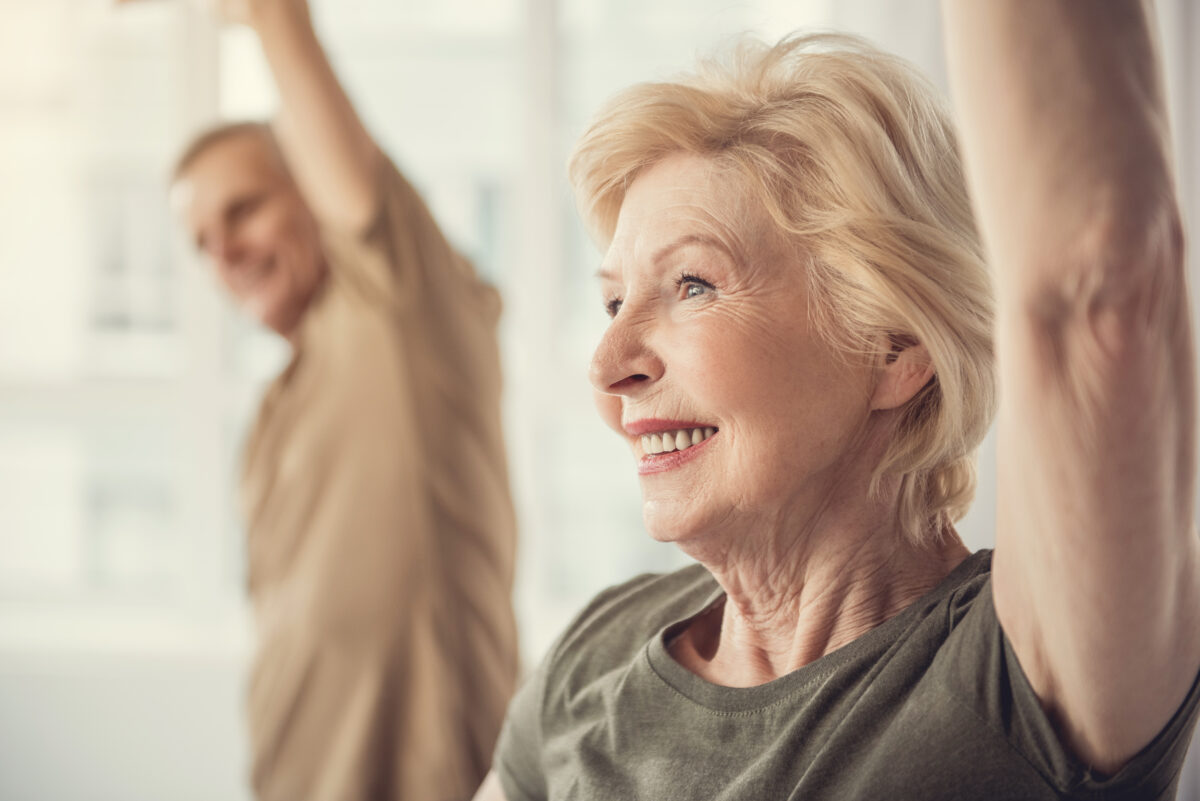 Older couple stretching.