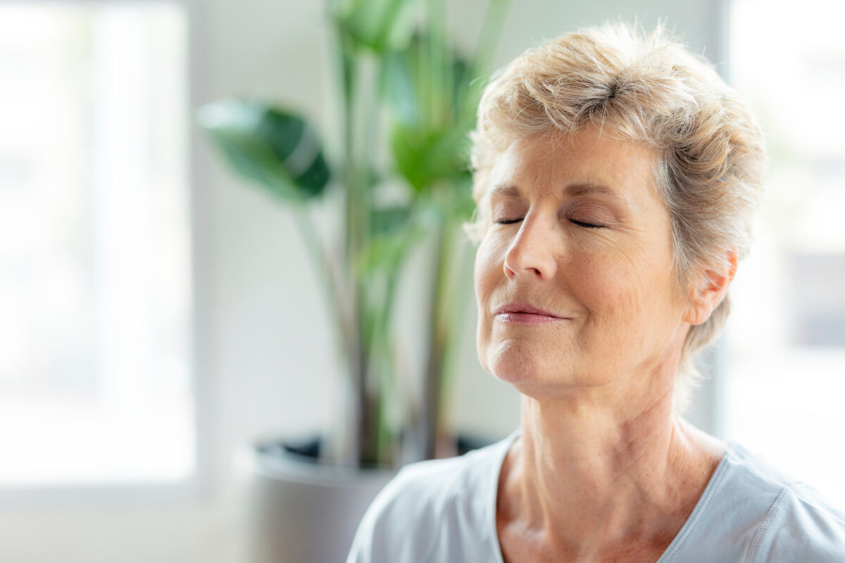 Woman holding in a deep inhale.